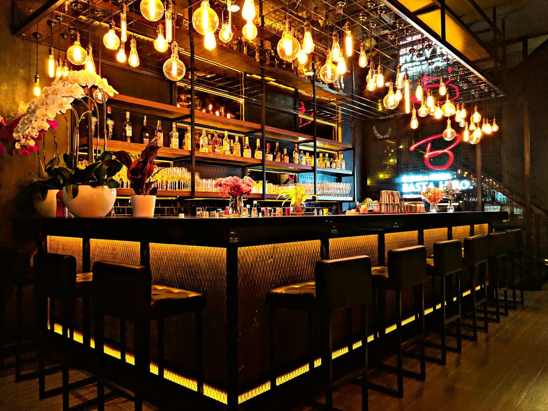 A warmly lit bar counter