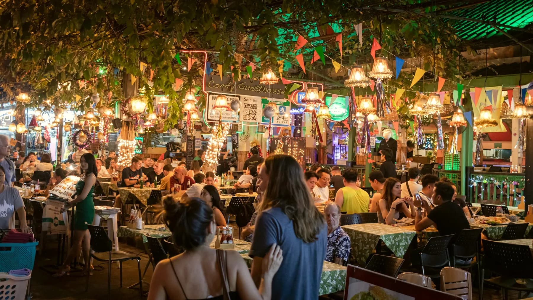 A crowded food court in the evening